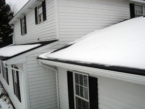 House with snow on it's roof prepared for winter.