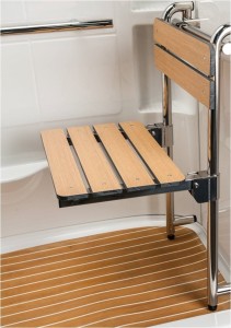 The synthetic teak shower chair may be repositioned in 3 different locations or removed altogether.