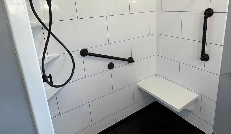 Shower seat and grab bars.