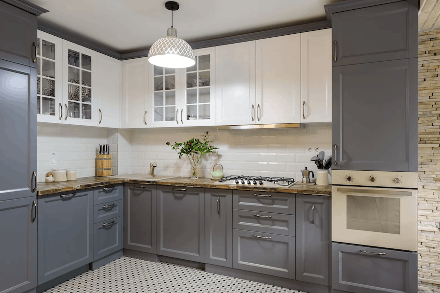 Refinished kitchen cabinets with updated paint and existing door style